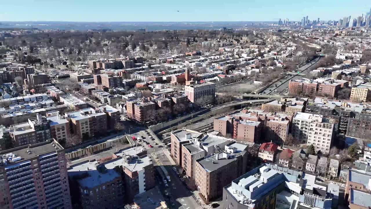Horizontal drone orbit shot over Ocean Parkway in Brooklyn, showcasing New York’s vibrant streets, residential architecture, and dynamic cityscape with smooth aerial movement.