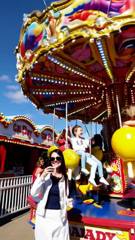 children enjoying a carousel ride at a fair