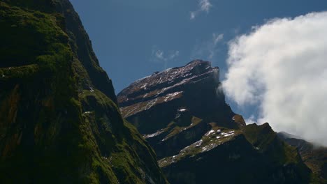 dramatic rugged rocky mountain scenery in nepal, large enormous rocky himalayas mountains in nepal with blue sky