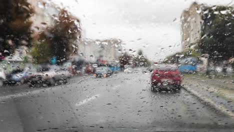 front car window covered with rain drops 02