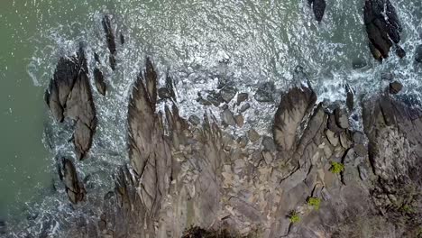 Aerial-Top-Down-Birds-Eye-View-Of-Generic-Ocean-Waves-Crashing-On-Rocks