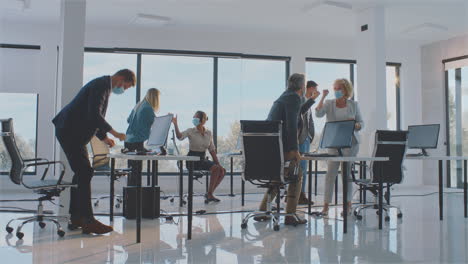 celebrating success in a modern office