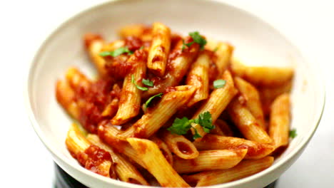 penne with parsley in slow motion