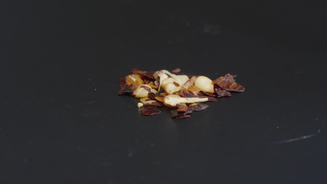chili spice close up with a black background