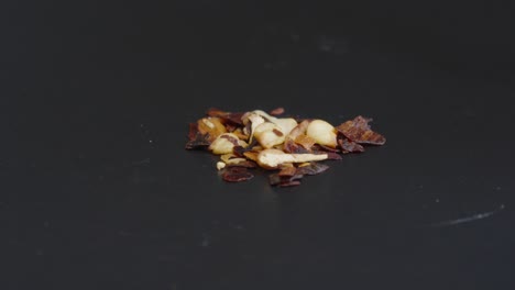 chili spice close up with a black background