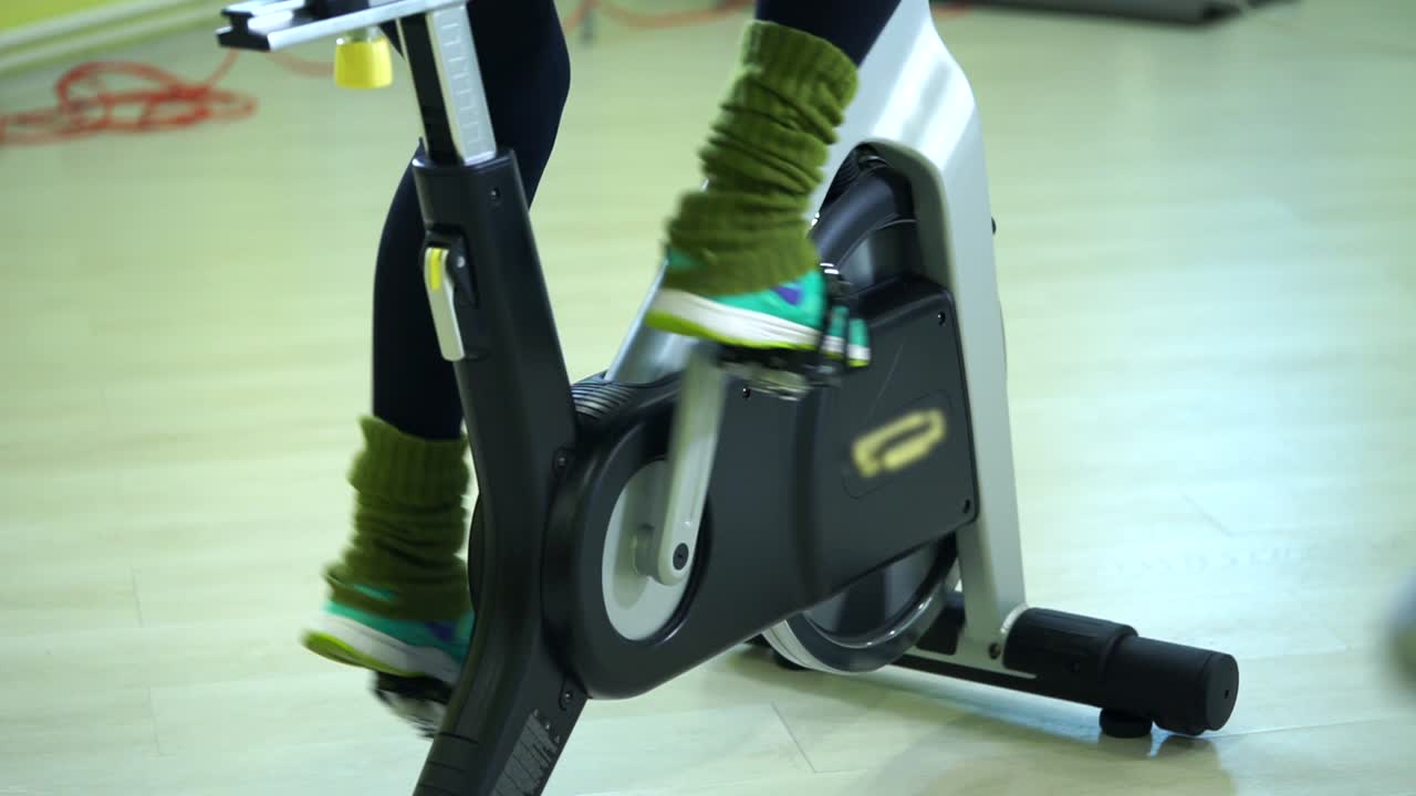 Woman on a stationary exercise bike