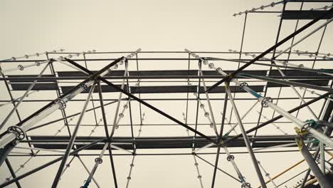 looking up push in shot of a tall scaffolding structure