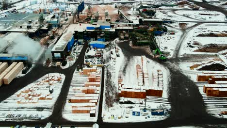 Panoramic-aerial-view-of-plywood-producing-sawmill-in-winter