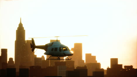 Silhouette-helicopter-at-city-scape-background