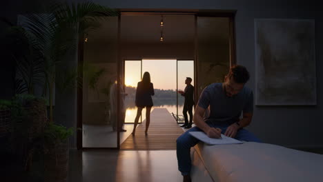 creative moment in a luxury lakeside home at sunset