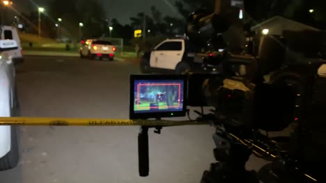 news cameras filming an active scene