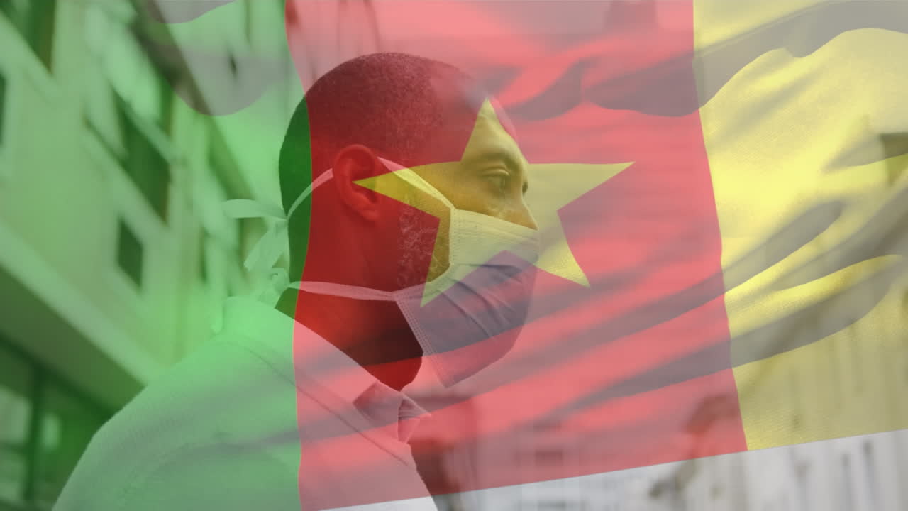 animación de la bandera de camerún ondeando sobre un hombre afroamericano con máscara facial en la calle de la ciudad