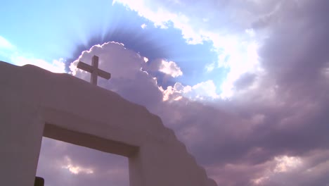 a christian cross glows against a heavenly sky 1