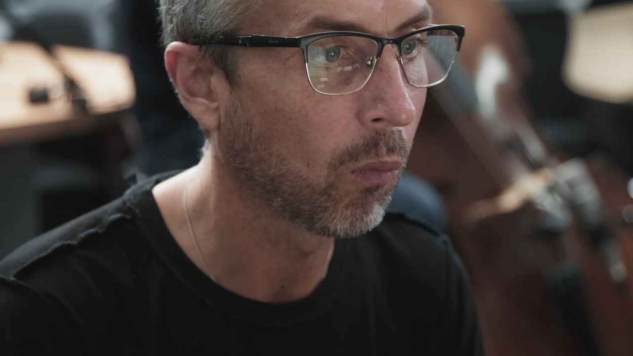 Close Up Of Adult Jazz Pianist At Recording Studio