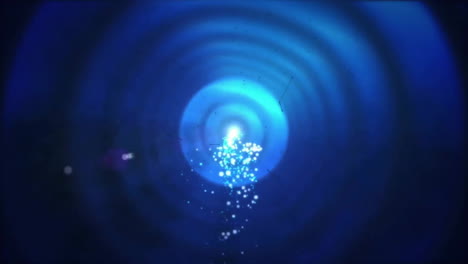 animation of glowing spots and trails of light moving on black background
