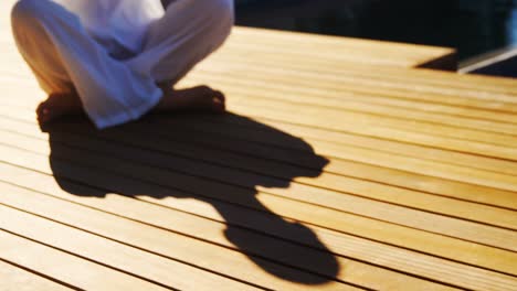 woman performing yoga near pool side 4k