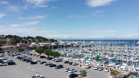 wide rising aerial shot of the old fisherman's wharf in monterey, california