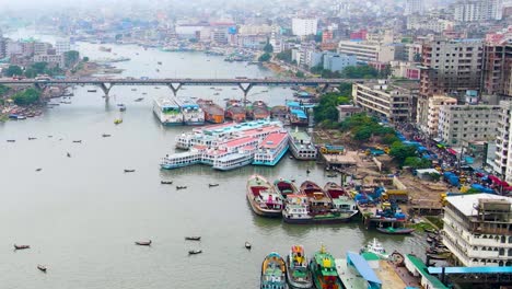 aerial view of ships docked along buriganga rivershore at the busiest port in dhaka bangladesh