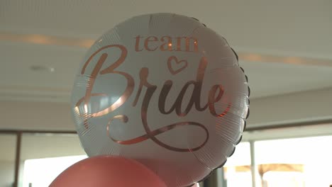 shinning white color balloon of team bridge, close up motion shot