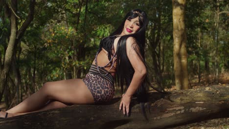 wearing shorts, a woman wanders through the tropical beauty of a park in trinidad.