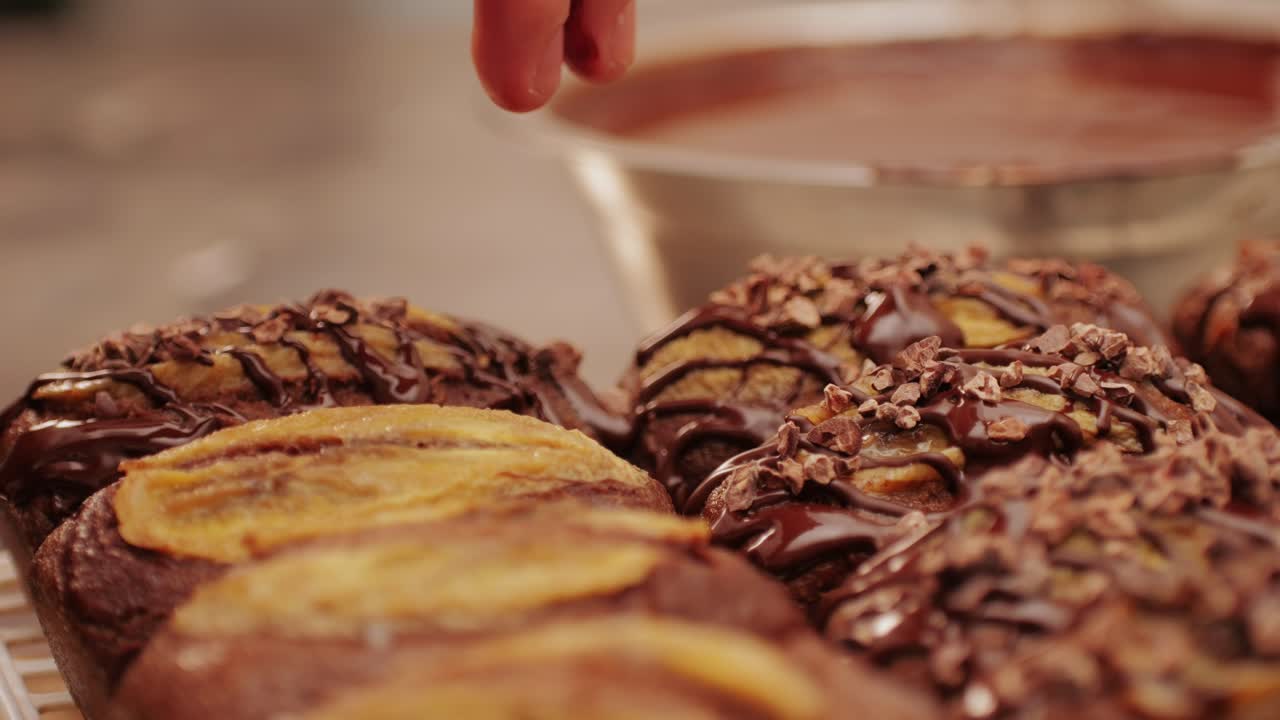 Fresh bake double chocolate banana artesian bread in bakery shop close-up. Artisan bread is making by skill bakers using natural and high-quality ingredients. Food with health and flavour benefits. Sweet breads for dessert and breakfast