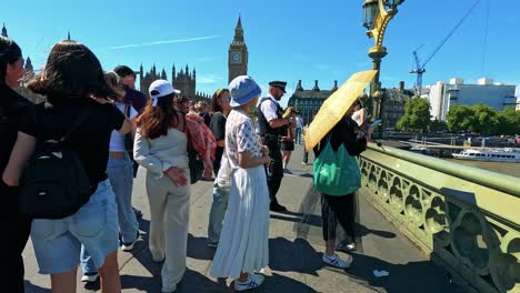 crowds gather near big ben in london