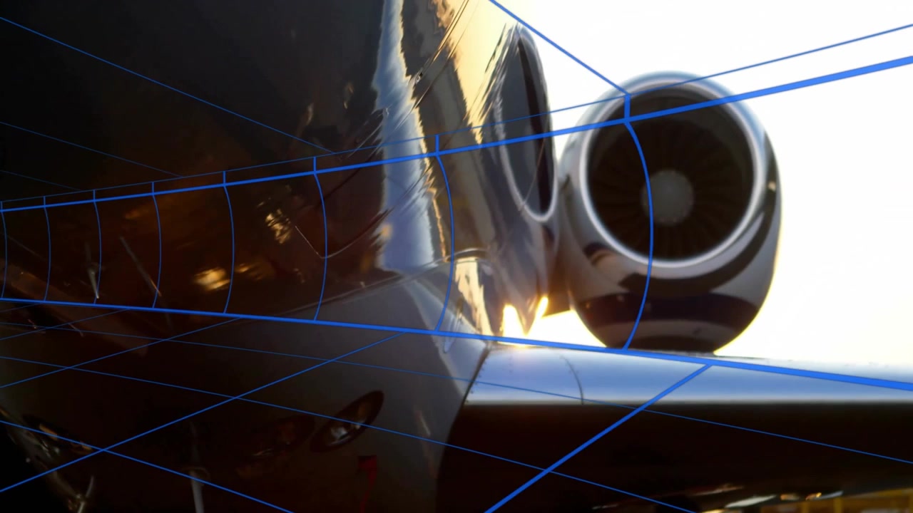 Presa d'aria del motore a reazione e radice dell'ala che mostrano una sovrapposizione di griglia blu, con pale della turbina che ruotano in un rendering 3D.