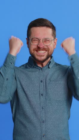 happy mature man celebrating success winning victory lottery jackpot goal achievement good news
