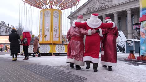 drunk men in santa claus costumes resting in a pub drunk men in santa claus costumes resting in a pub christmas time group of santa clauses