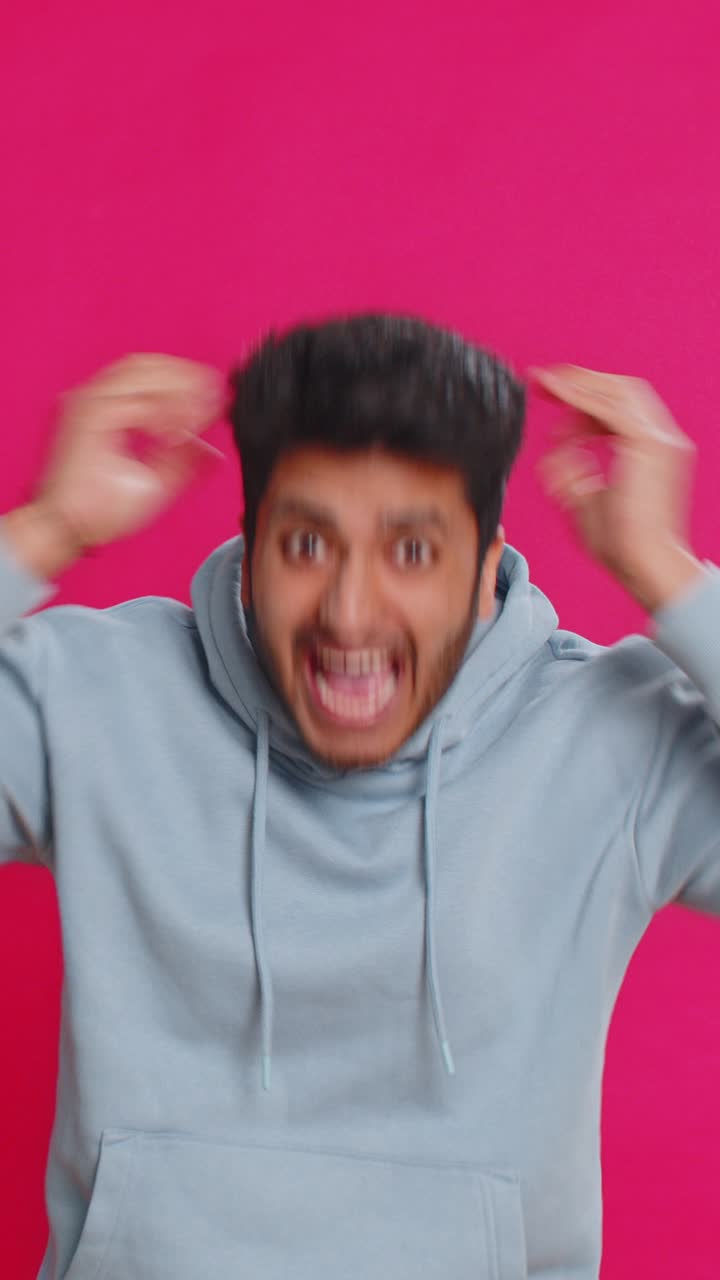 Happy indian man celebrating success winning birthday lottery jackpot goal achievement good news