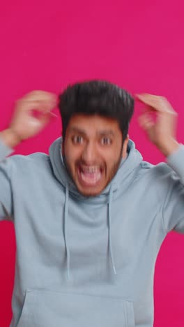 happy indian man celebrating success winning birthday lottery jackpot goal achievement good news
