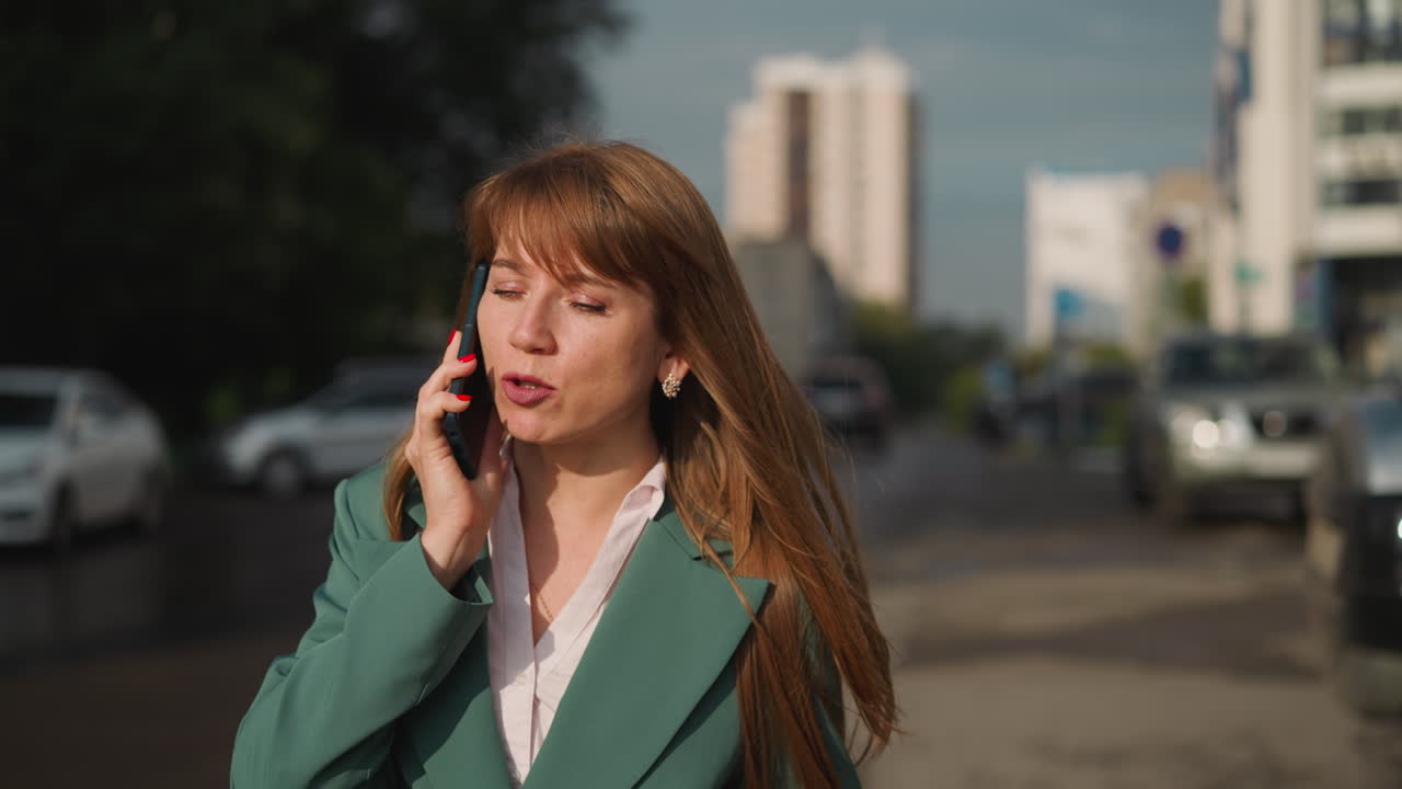 Worried woman approaches car talking on phone and ends call