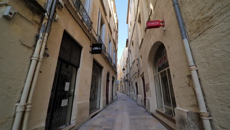 beautiful narrow street in montpellier nobody and closed shops lockdown period