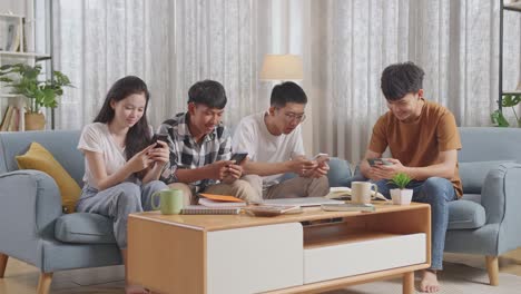 friends using smartphones at home