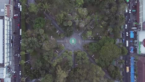 huge park in the center of a city in el salvador - aerial shot