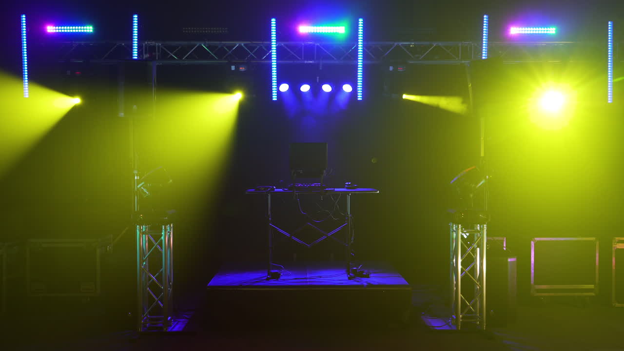 DJ Setup on Stage with Colorful Lighting