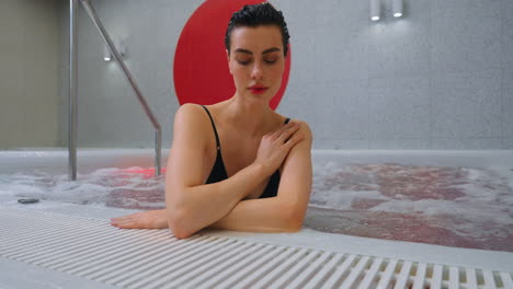 woman relaxing in a modern hot tub