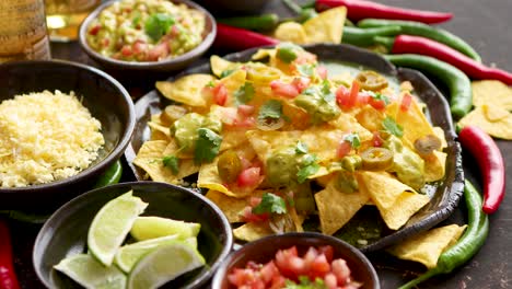 Tasty-mexican-nachos-chips-served-on-ceramic-plate