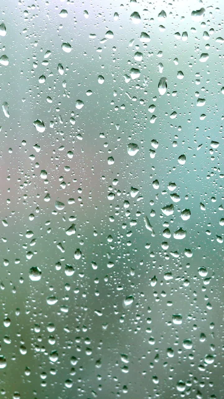Rain drops on the glass Vertical video