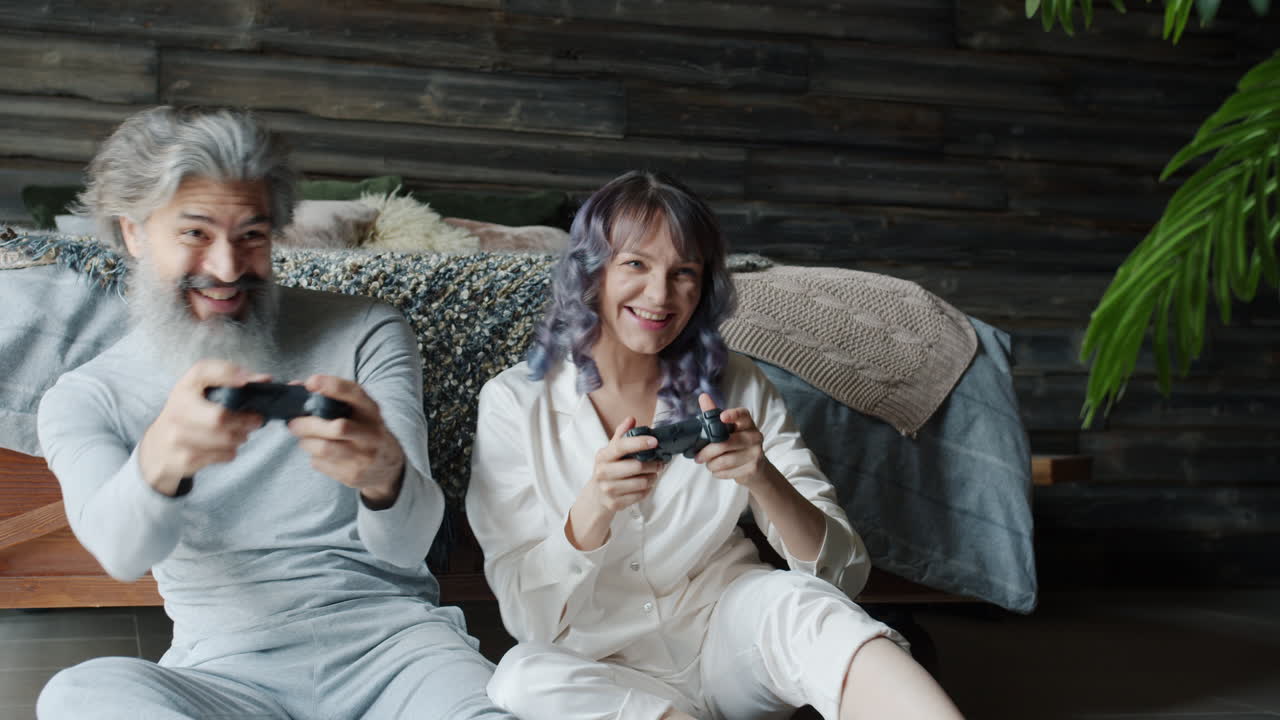 Happy Couple Playing Video Games at Home