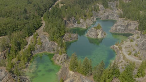 Beautiful-Aerial-View-of-the-Colorful-Lakes-in-the-Canadian-Nature-during-a-sunny-summer-day