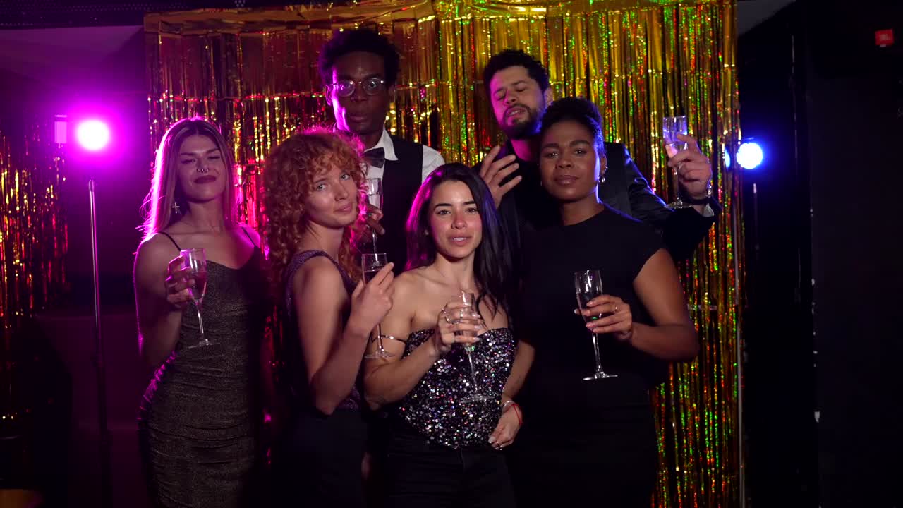 Group of people celebrating with champagne at a party