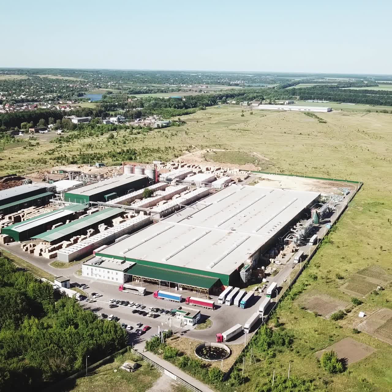 location of the production facilities of the plant for the manufacturing of a parquet board outside the city. Aerial view