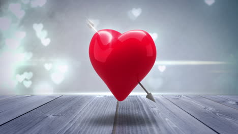 corazón rojo con una flecha girando en un fondo brillante