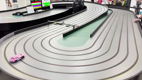miniature cars racing on a winding track