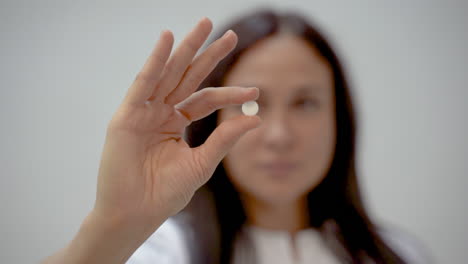 female nurse takes off her medical mask and smiles