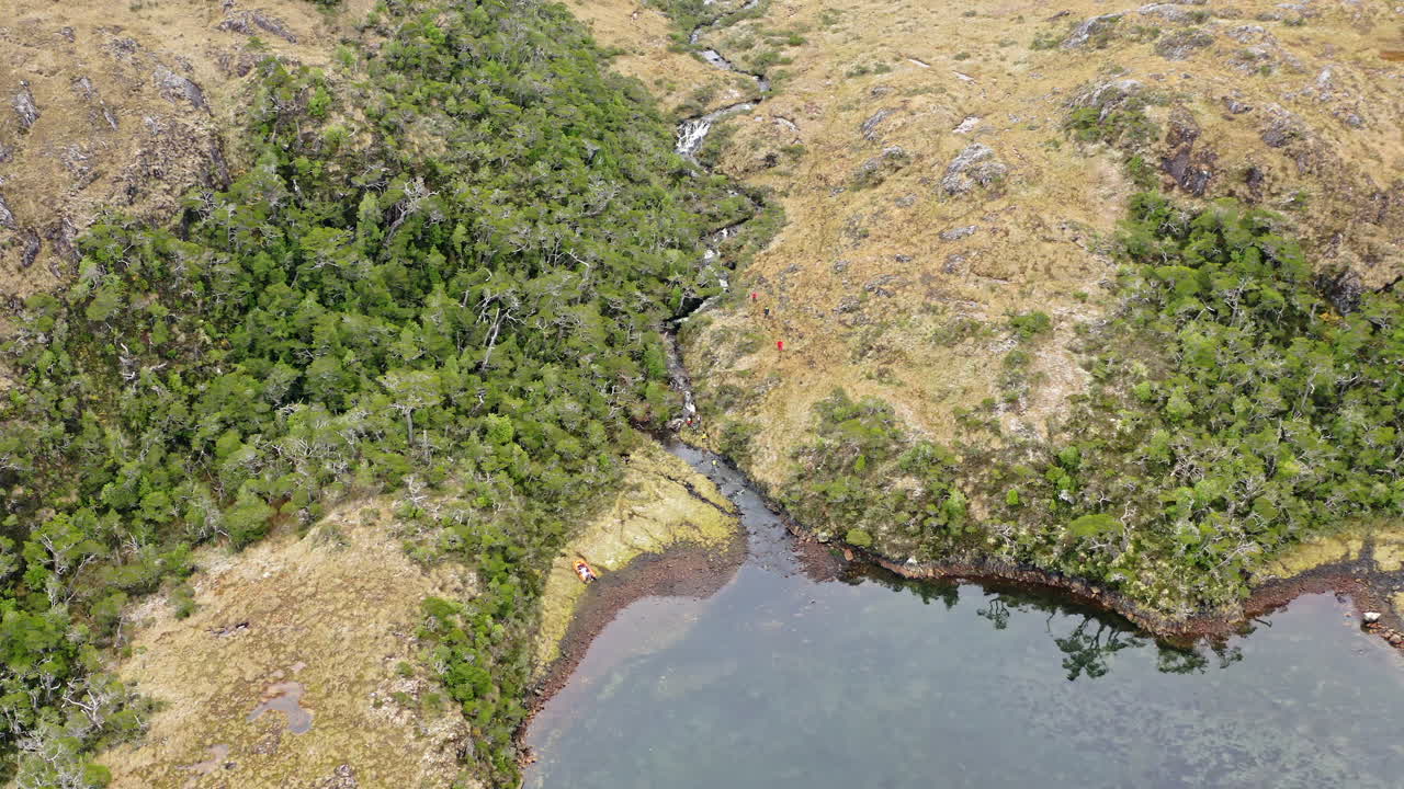 People Trekking Over Valleys At Beagle Channel Strait At The Southern Tip of South America. Aerial Shot