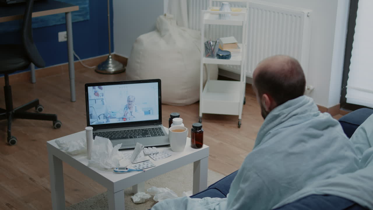 Man with disease using video call for telemedicine