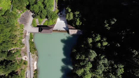 top view of the green woods surrounded the waterscape of klammsee lake in kaprun, austria