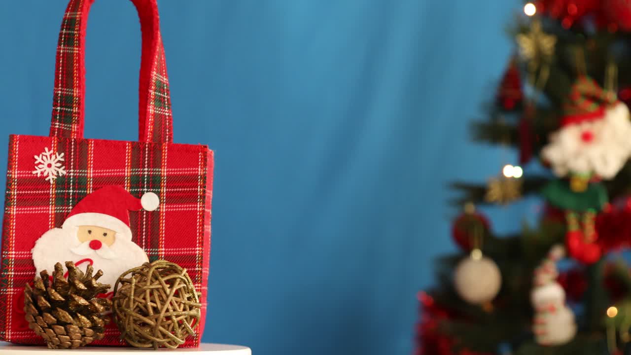 Christmas present rotating in front of the tree